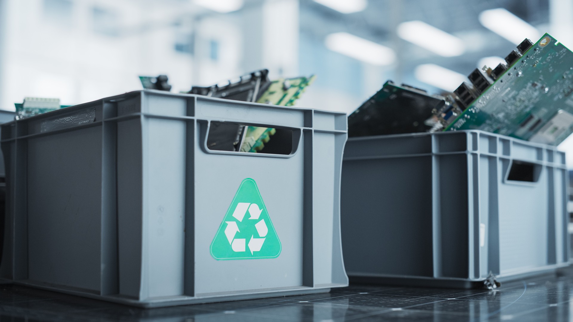 Close Up Shot Of Boxes With Computer Parts Sorted For Recycling At Sustainable Electronics Factory. Motherboards And Microchips Are Collected And Prepared For Reuse in Modern Technological Devices.